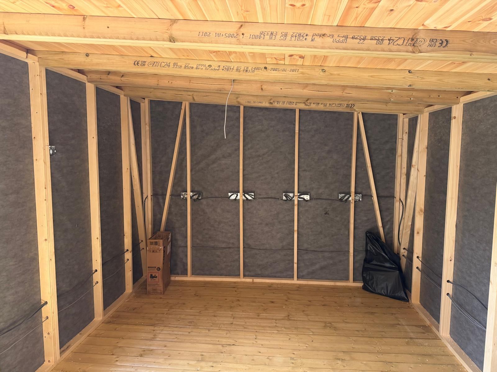 First fix electrical wiring and sockets in a timber-framed garden office before boarding