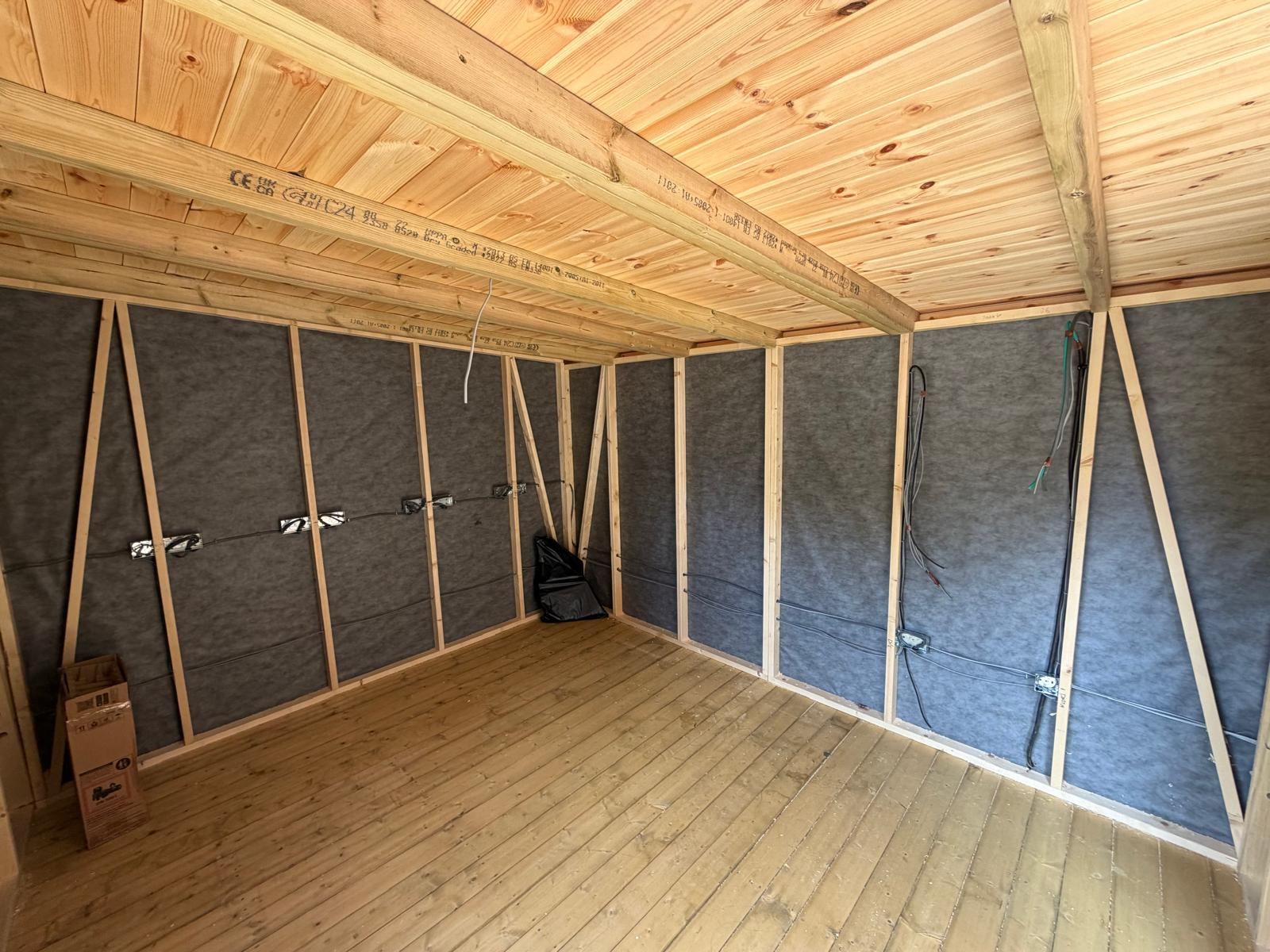 First fix cabling run through a timber-framed garden office ready for insulation