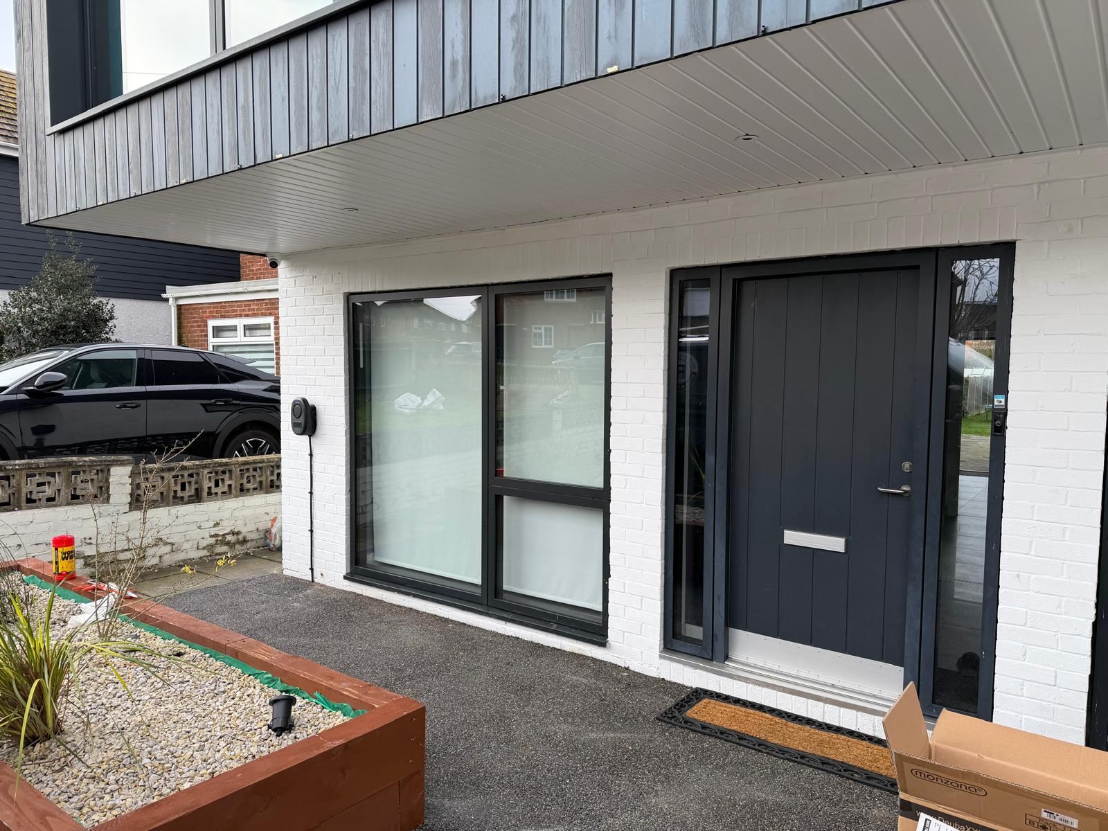 EV charge point installed beside the front door of a new-build property