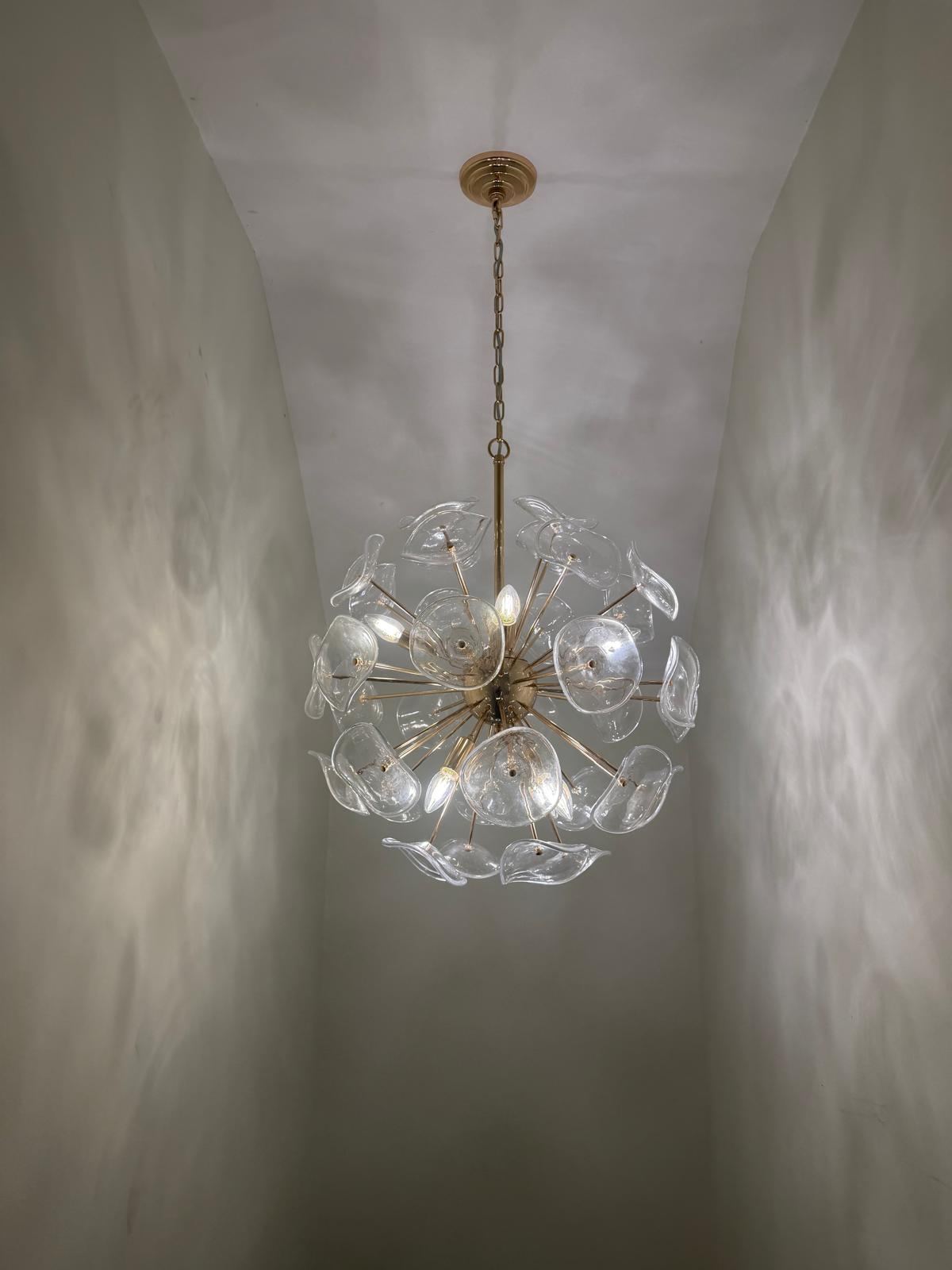 Sputnik-style glass chandelier installed in a hallway