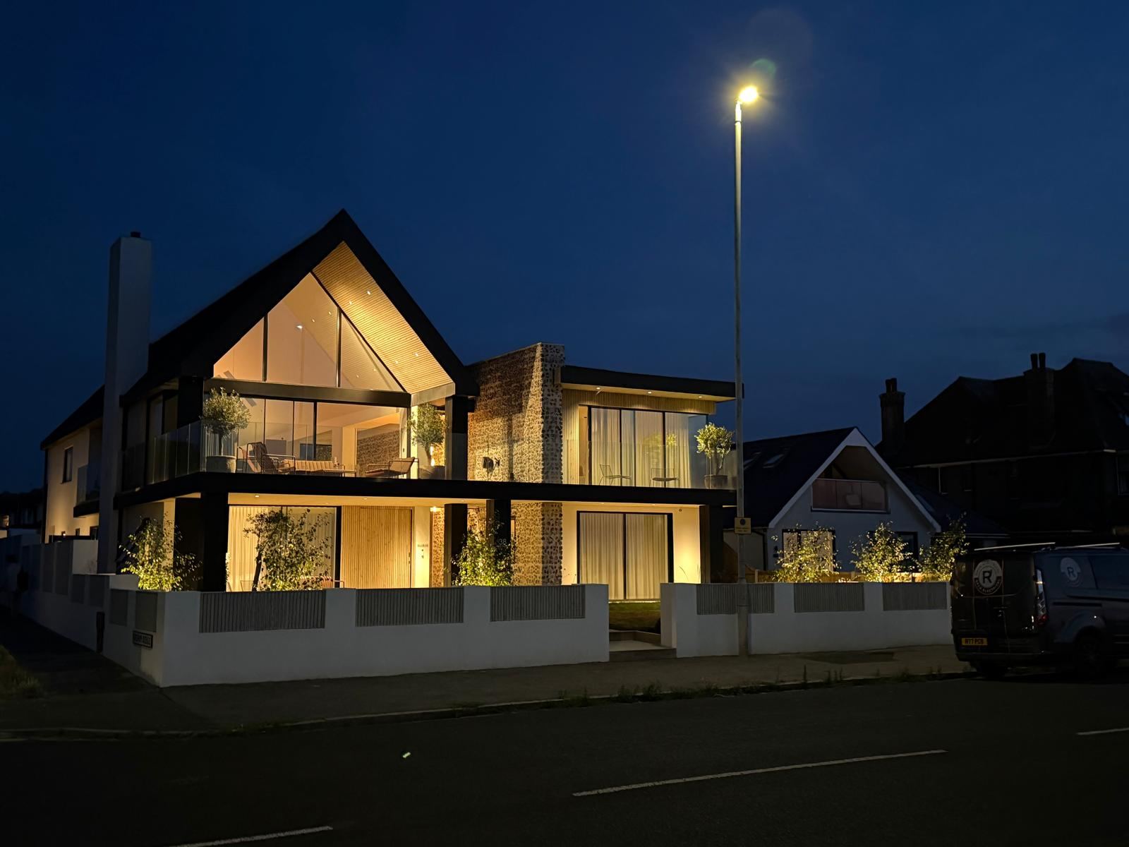A fully automated new-build home on Westbrook seafront, lit at dusk by RPCB Electrical's external and feature lighting installation